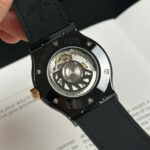 Super Clone Hublot Classic Fusion Ceramic Carbon Dial King Gold JJZ 42mm Base — on leather display