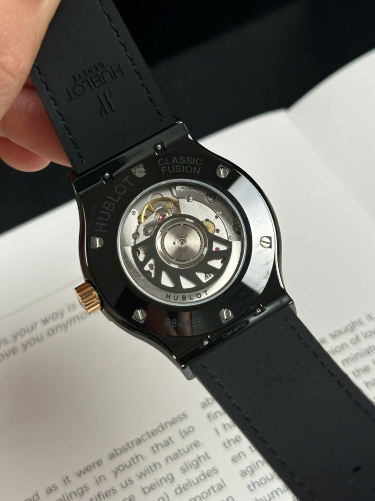 Super Clone Hublot Classic Fusion Ceramic Carbon Dial King Gold JJZ 42mm Base — on leather display