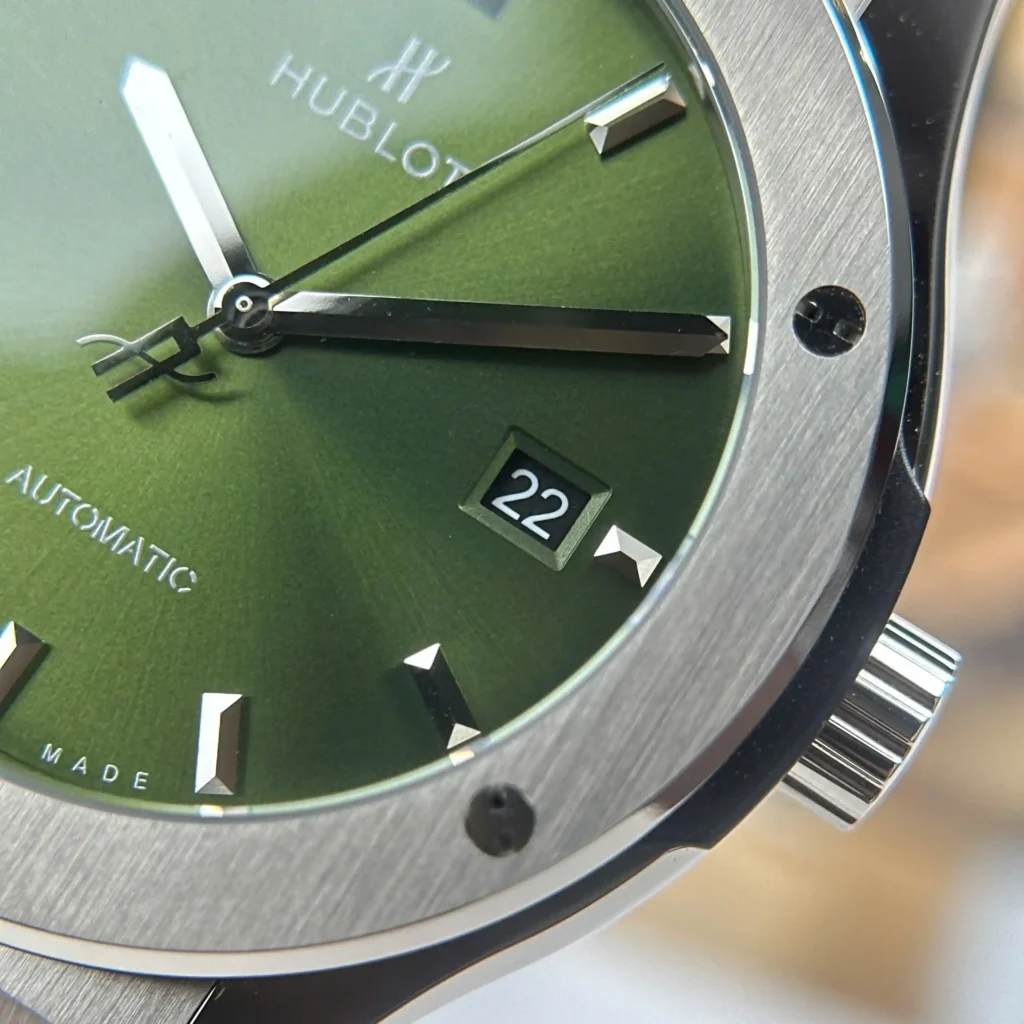 Super Clone Hublot Classic Fusion Titanium Green 542.NX.8970.LR 42mm — on leather display