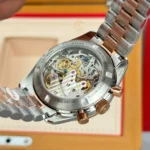 Super Clone Omega Speedmaster Moonwatch Professional 310.20.42.50.99.001 42mm Demi Rose Gold — on leather display
