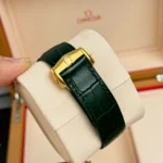 Super Clone Omega Speedmaster Moonwatch Professional 42mm 310.63.42.50.10.001 Green Dial Yellow Gold — on leather display