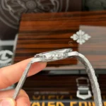 Super Clone Patek Philippe Nautilus 5712/1A 40mm Custom Full Moissanite Baguette HongKong – Customize Diamod — on leather display