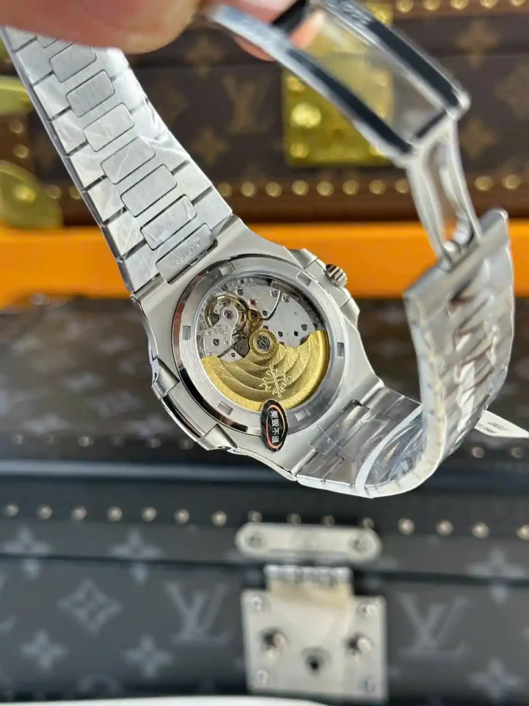 Super Clone Patek Philippe Patek Nautilus 5713G Green Dial 40mm Moissanite – Handcrafted Diamod — on leather display