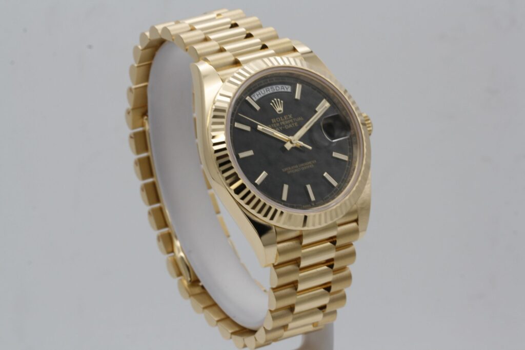 Super Clone Rolex Day-Date Black Dial 228238 40 mm — on leather display