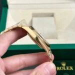 Super Clone Rolex Day-Date II Champagne Dial 228238 40 mm — on leather display