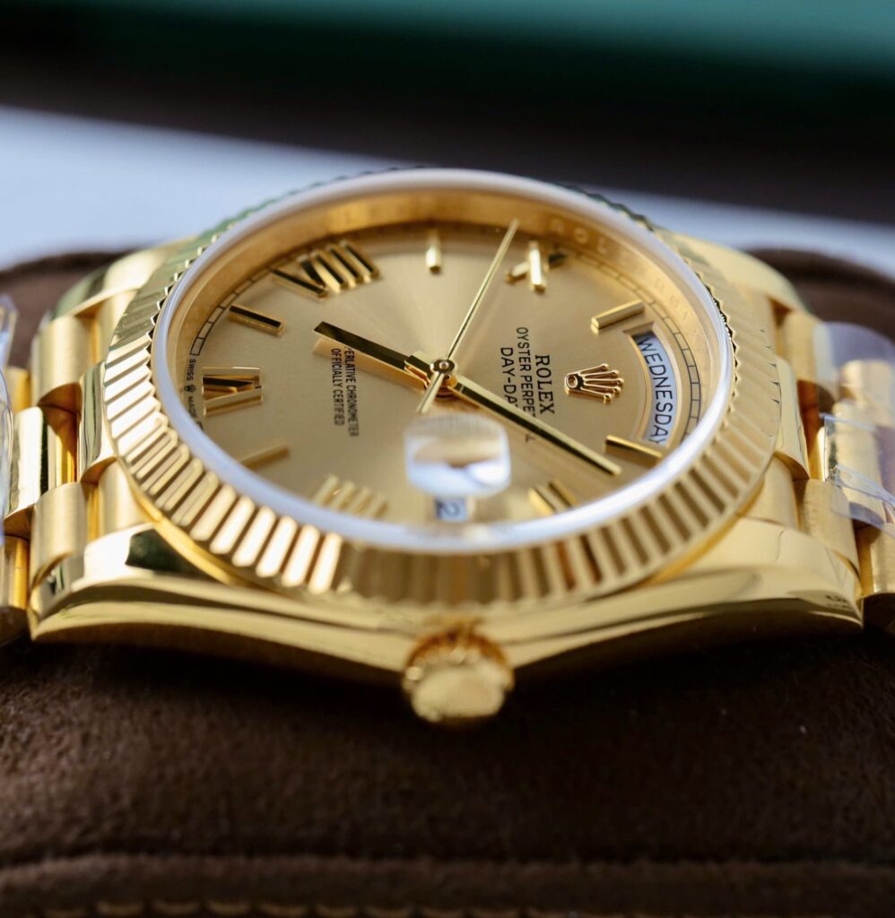 Super Clone Rolex Day-Date Roman Champagne Dial 228238 40 mm — on leather display