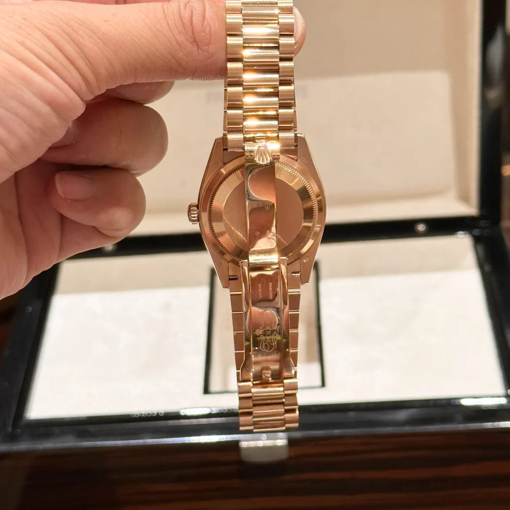 Super Clone Rolex Day-Date White Mother-of-Pearl Diamond Dial 128235-0029 36 mm — on leather display