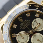 Super Clone Rolex Daytona Black Dial Yellow Gold 126518LN — on leather display